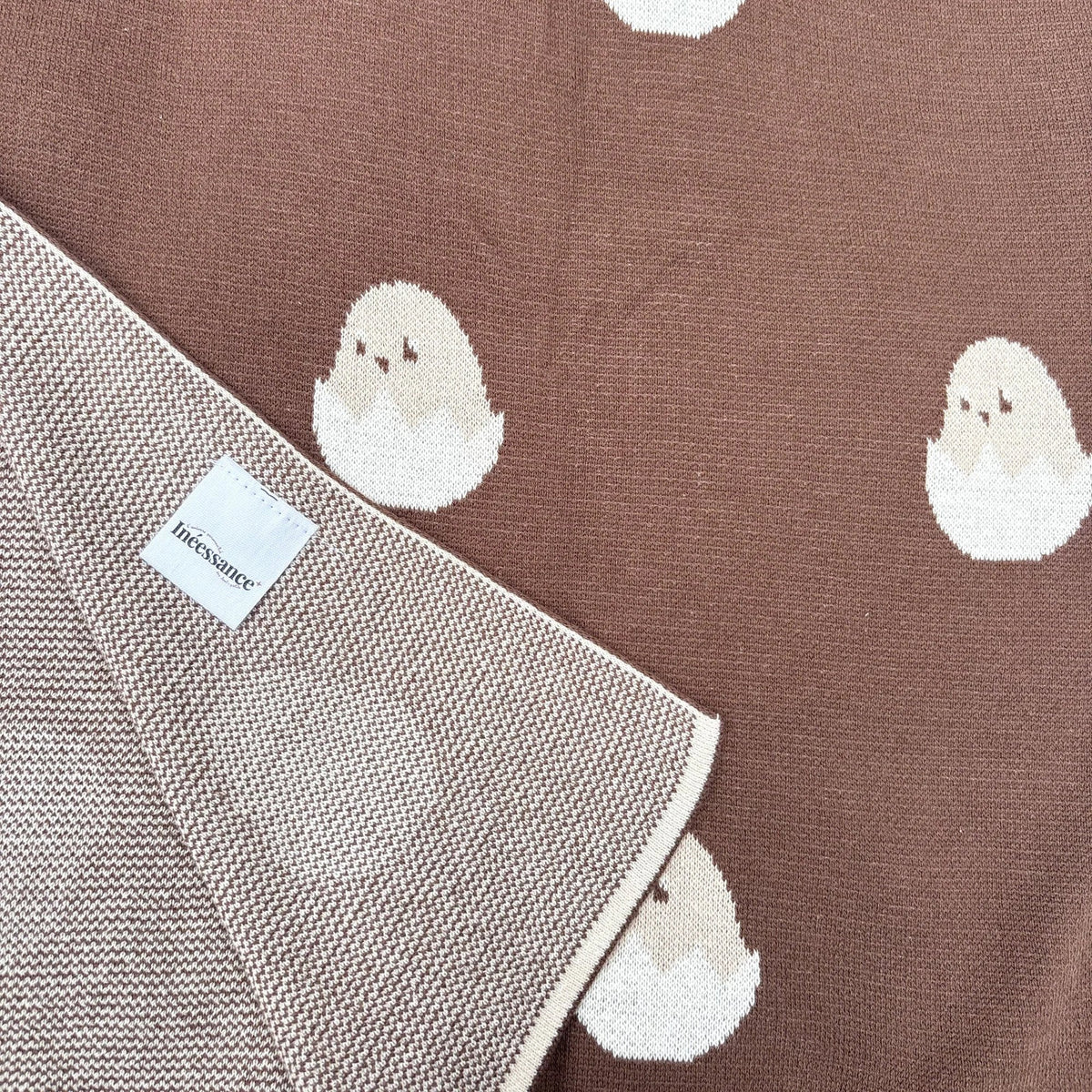 Couverture bébé en maille jacquard réversible à motifs